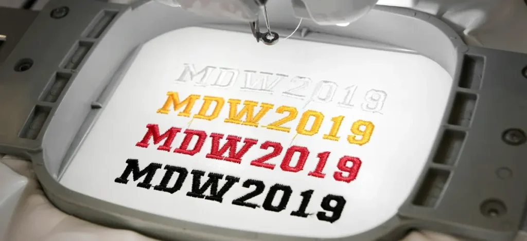 custom embroidered polo t-shirts closeup embroidery machine